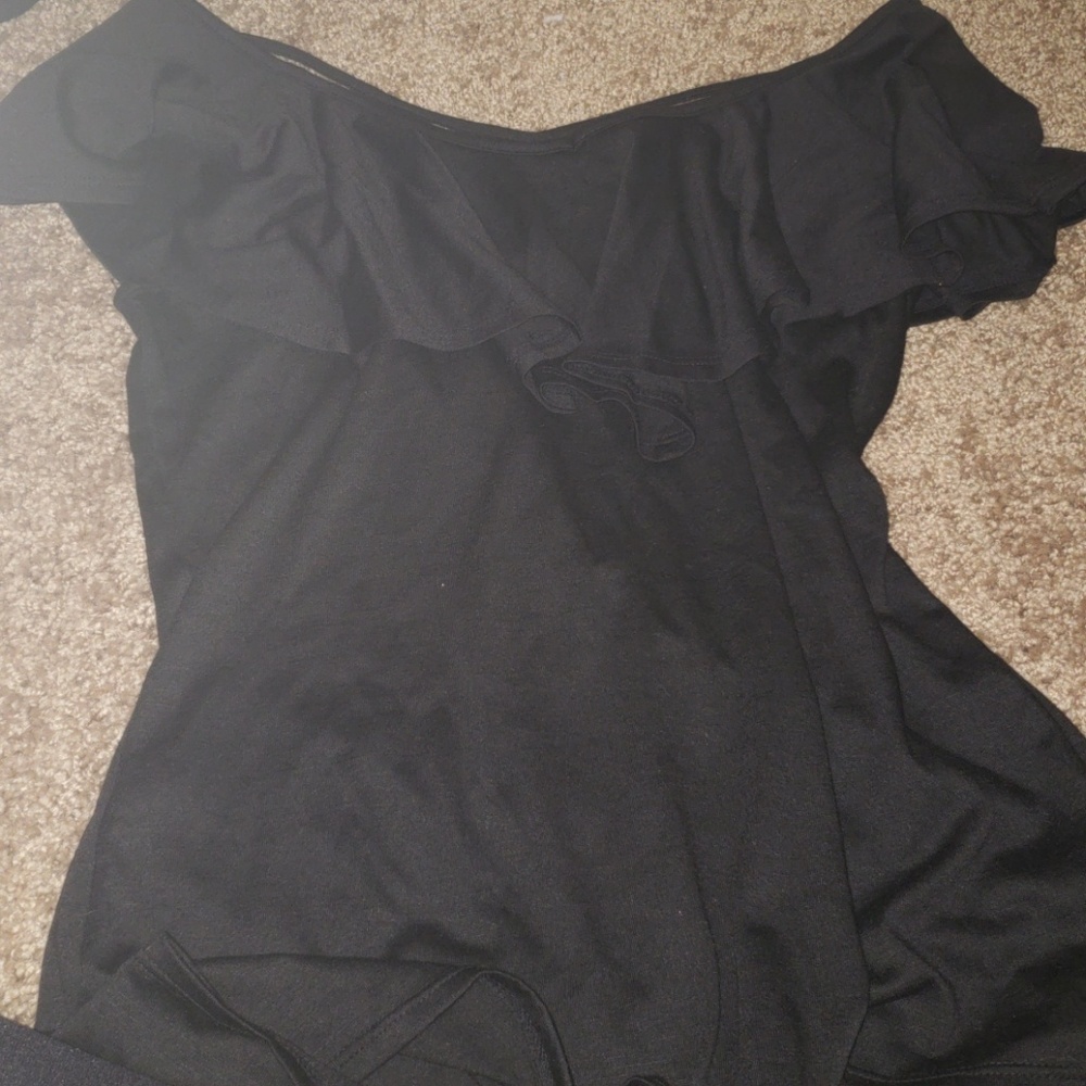 black shirt over the shoulders